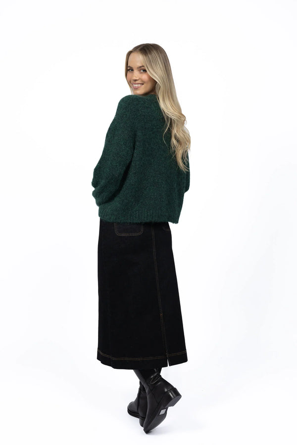 Woman wearing neve green jumper and Nevada Skirt - Black