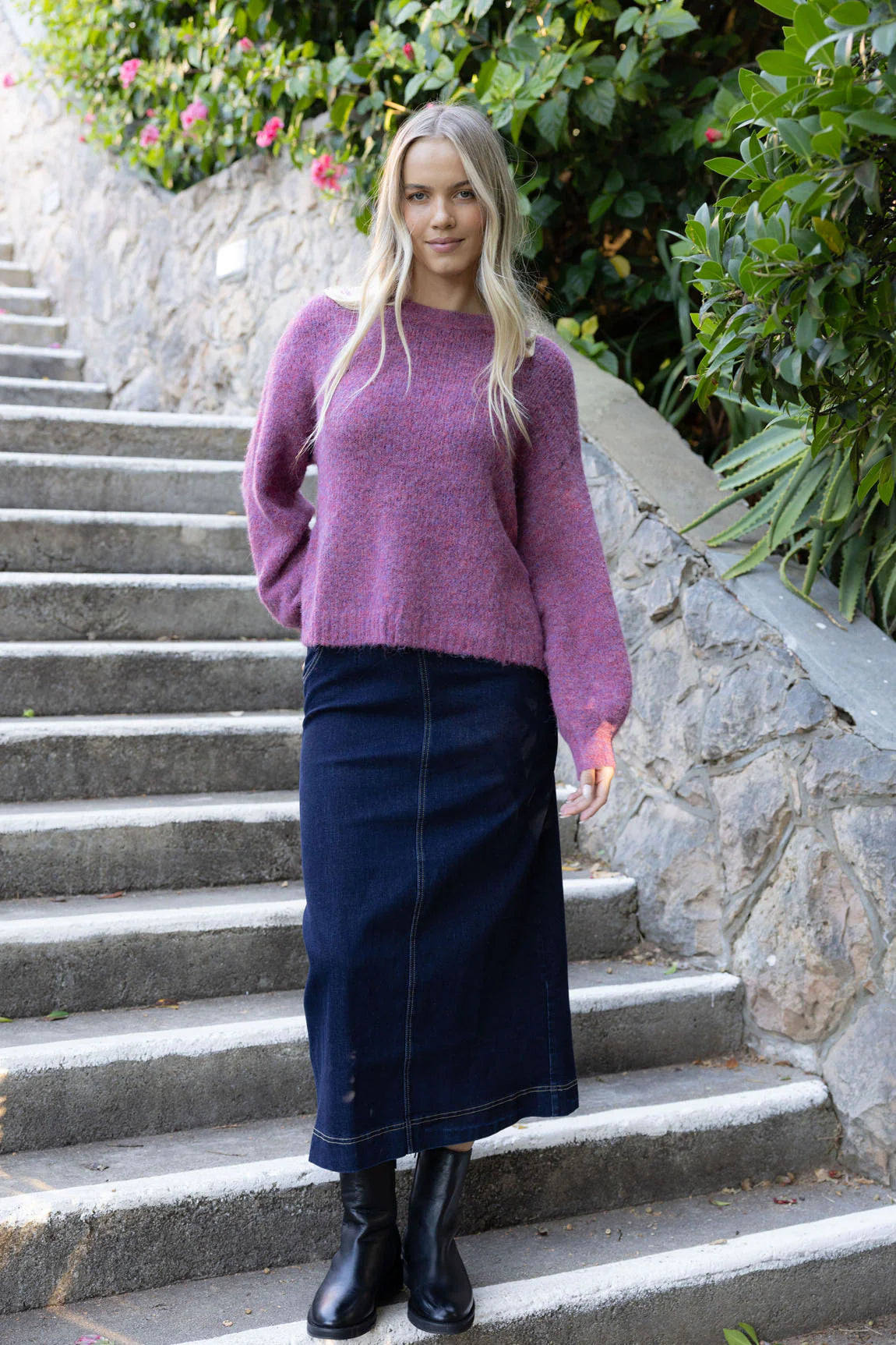 Woman wearing long sleeve violet jumper and Nevada Skirt -Dark Blue