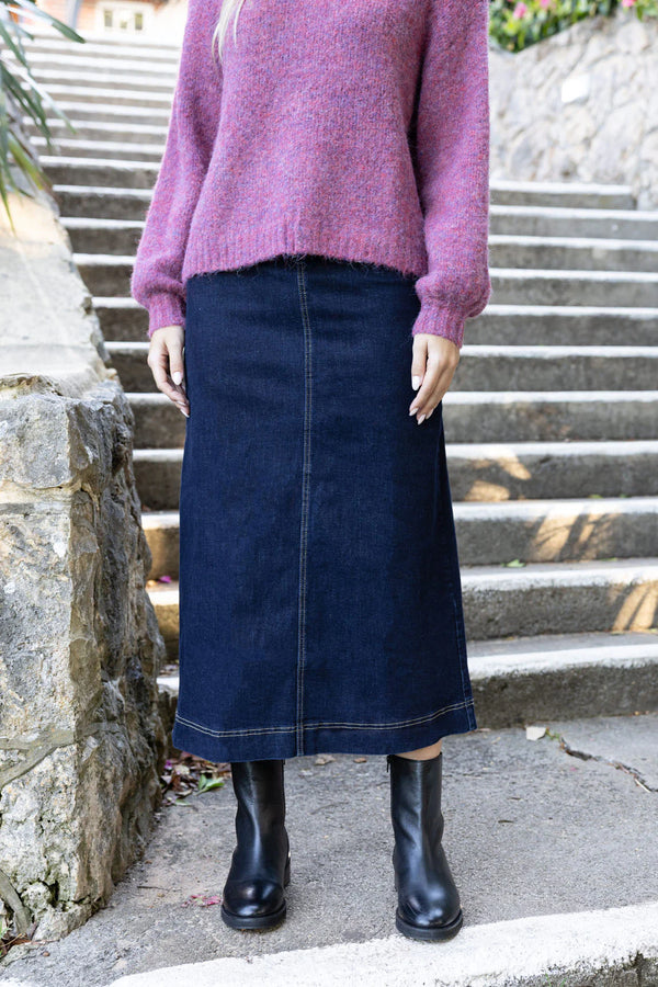 Woman wearing long sleeve violet jumper and Nevada Skirt -Dark Blue
