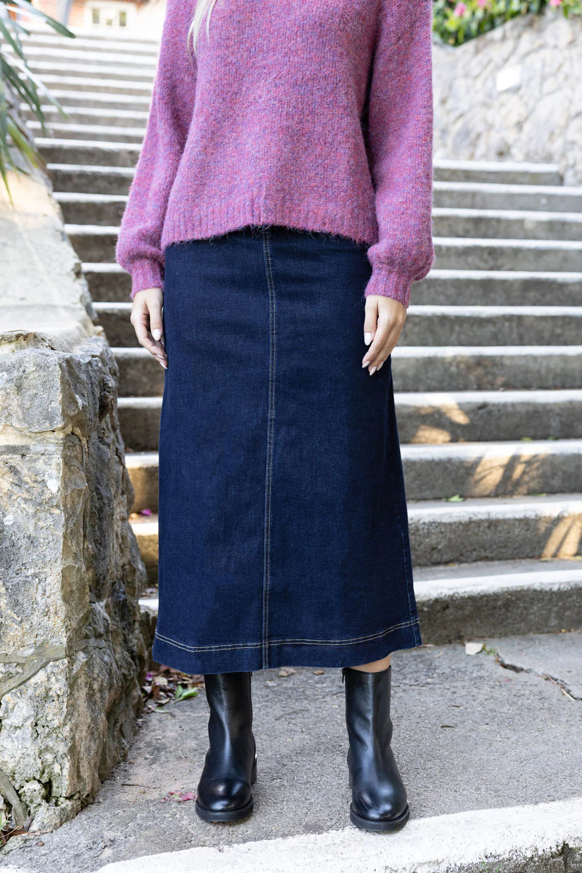 Woman wearing long sleeve violet jumper and Nevada Skirt -Dark Blue