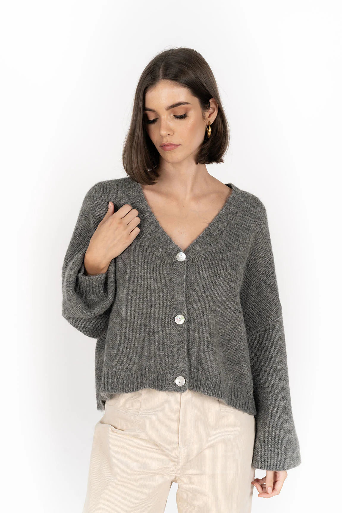 Potrait image of woman wearing Zia Jumper - Grey and pebble pants