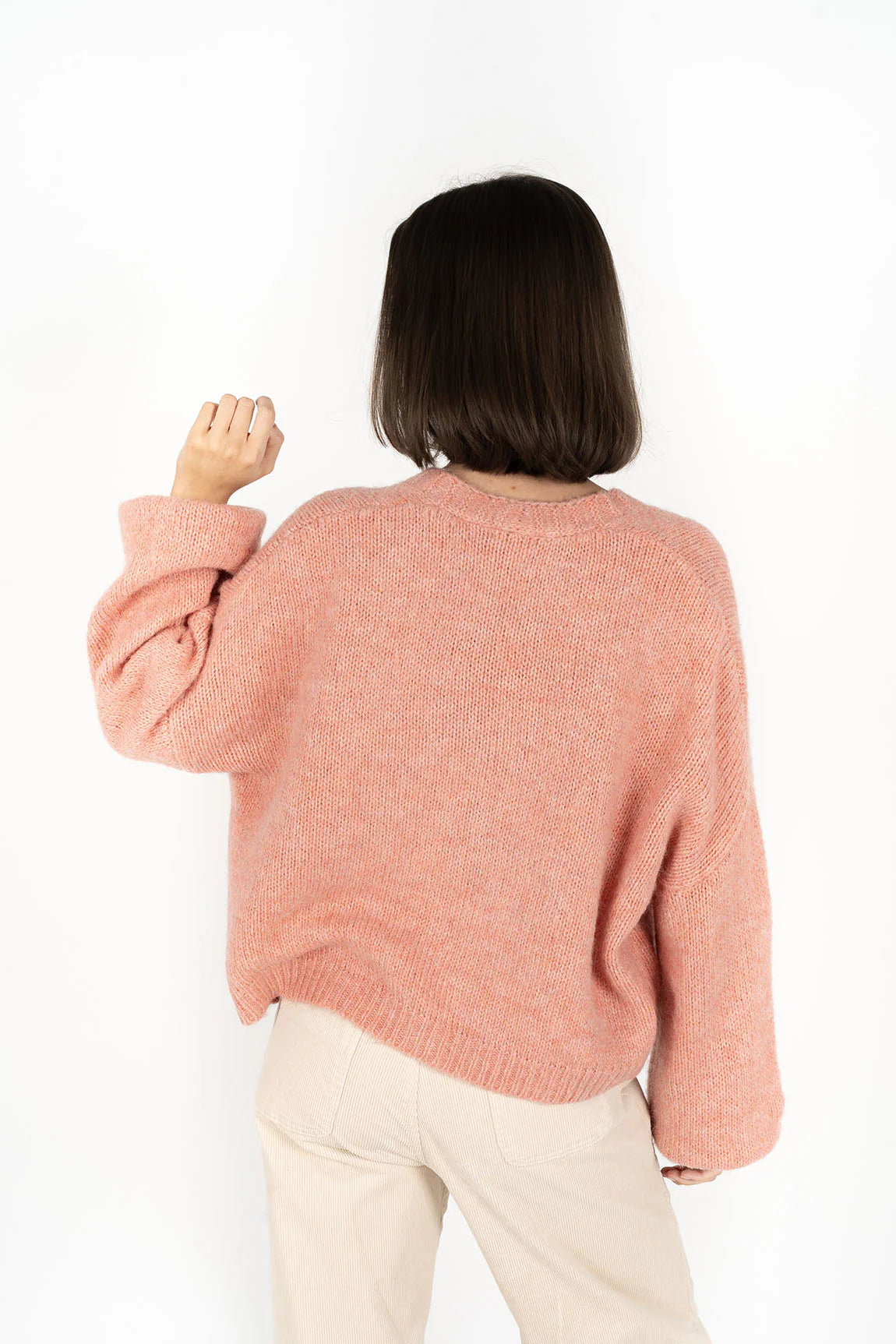 Portrait image of woman facing the back wearing Zia Cardi - Coral and pebble pants
