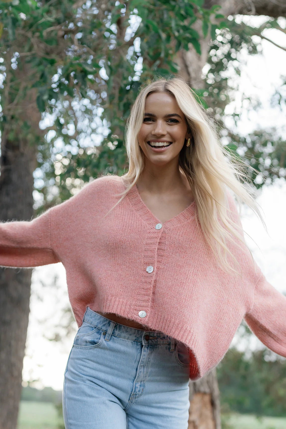 woman wearing Zia Cardi - Coral and denim pants
