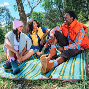 women and a man wearing bobbi ankle boot in Bobbi Boot - Rust, forest green, and blue
