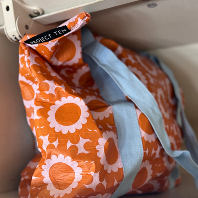 Zip Medium tote bag in geo floral pattern inside the cabinet