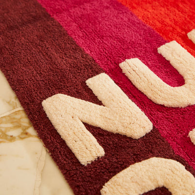 closer look of nudie rudie bath mat design