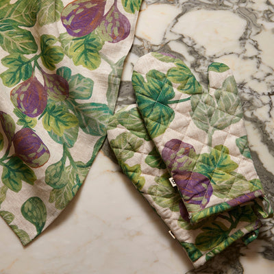 figgy green quilted linen mitt and figgy green tea towel in the counter top