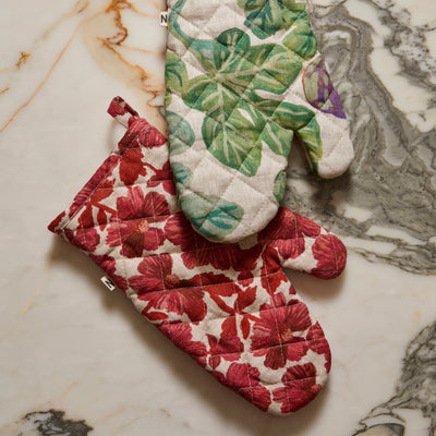 Leon Cerise Oven Mitt and figgy green quilted linen mitt in the marble counter top