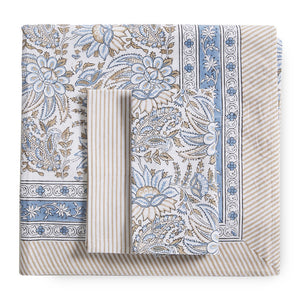 canvas and sasson folded bromley 4 set napkin in cornflower design  features a striking, ornate floral design in tones of blue and taupe on a white cotton base