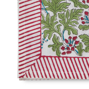 edge of canvas and sasson tableau joy napkin set of 4 floral design in scarlet red, sky blue and fern on a white base, finished with a scarlet red and white striped border.