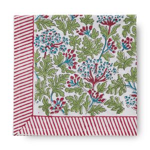 folded canvas and sasson tableau joy tablecloth features a continuous floral design in scarlet red, sky blue and fern on a white base, finished with a scarlet red and white striped border.