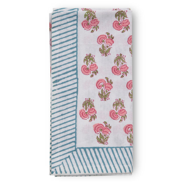 folded canvas and sasson tableau napkin in all-over poppy print in hues of pinks and greens s on a white cotton base, finished with a beautiful blue and white striped border.