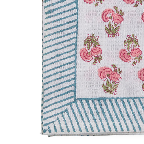edge of canvas and sasson tableau napkin in all-over poppy print in hues of pinks and greens s on a white cotton base, finished with a beautiful blue and white striped border.