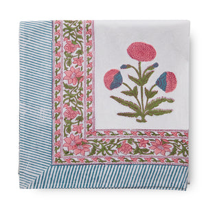 canvas and sasson tableau tablecloth in Pink features a large Mughal poppy print in hues of pinks, greens and blues on a white cotton base, finished with a beautifully ornate flowing border and striped edge.