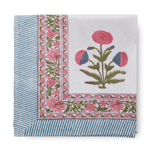 canvas and sasson tableau tablecloth in Pink features a large Mughal poppy print in hues of pinks, greens and blues on a white cotton base, finished with a beautifully ornate flowing border and striped edge.