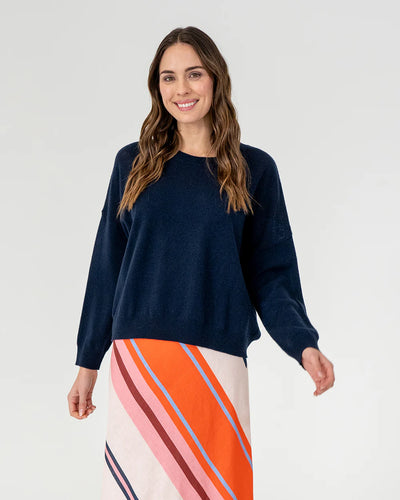 woman wearing Mornington Knit - Navy and skirt with diagonal stripe design
