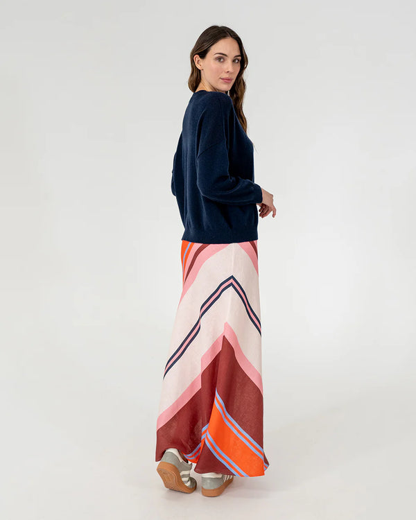 woman wearing Mornington Knit - Navy and skirt with diagonal stripe design