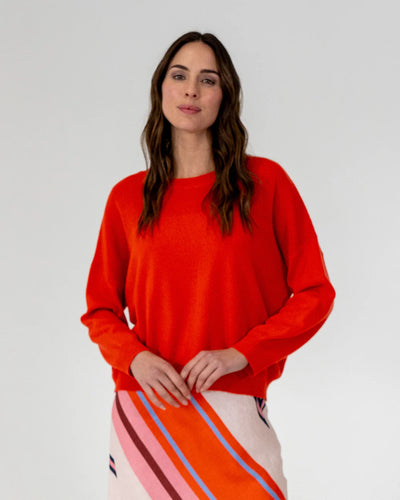woman wearing Mornington Knit - Poppy and skirt with diagonal design