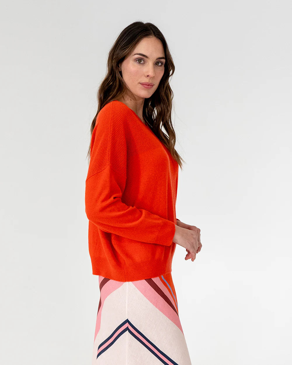 woman wearing Mornington Knit - Poppy and skirt with diagonal design 