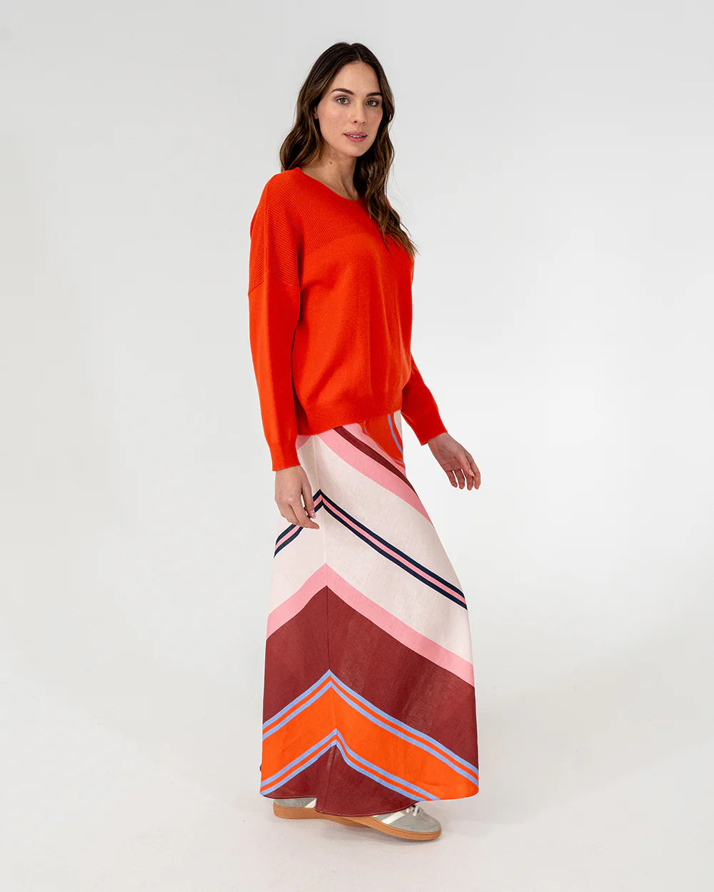 woman wearing Mornington Knit - Poppy and skirt with diagonal design