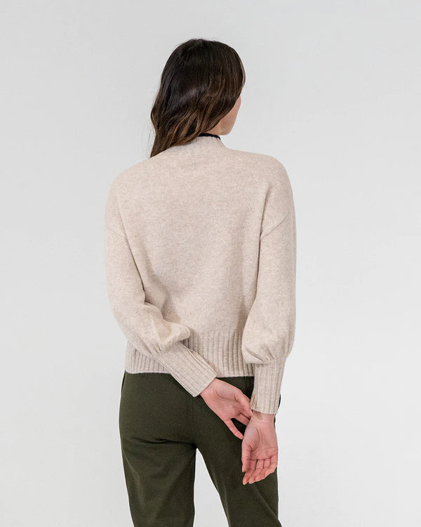 woman facing the back wearing Steward Knit - Oatmeal and khaki bottoms