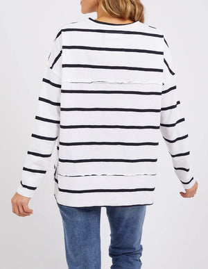 woman facing the back wearing denim pants and foxwood jayne stripe throw on top white dark  sapphire stripe