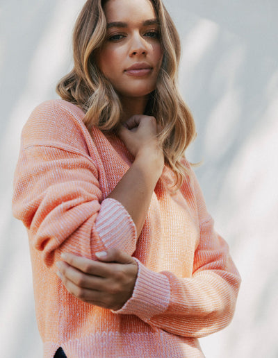 woman wearing foxwood wrenley knit tangerine