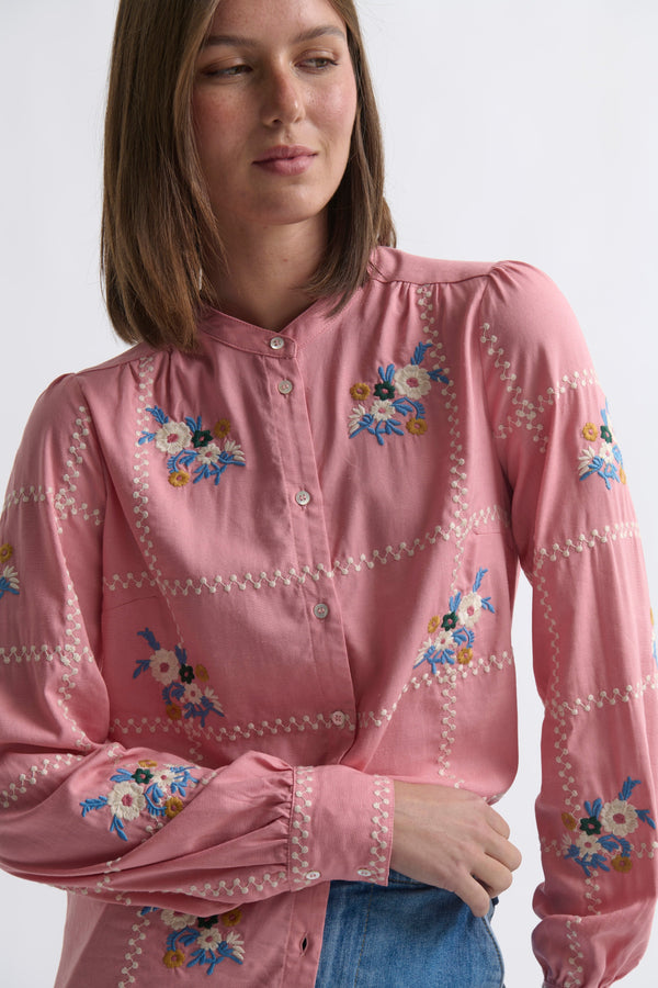 Kireina Carol Shirt in Musk Pink – close-up ecom shot showing the multicolour floral embroidery and white broderie trim detail on the musk pink shirt, on a white background