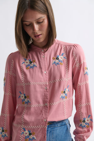 Kireina Carol Shirt in Musk Pink – upper-body ecom shot showing the multicolour floral embroidery clusters and white broderie trim detail across the front of the musk pink shirt, on a white background