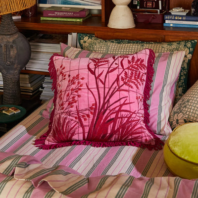 Bed with Adelyn Embroidered Cushion - Cosmo Pink, stripe pillowcase, and bed cover