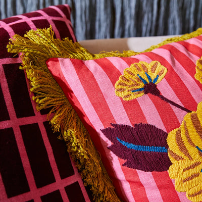 Closer look of Annette Cushion in Cosmo Pink embroidery design and fringe