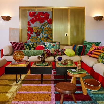 living room with sofa and different cushion
