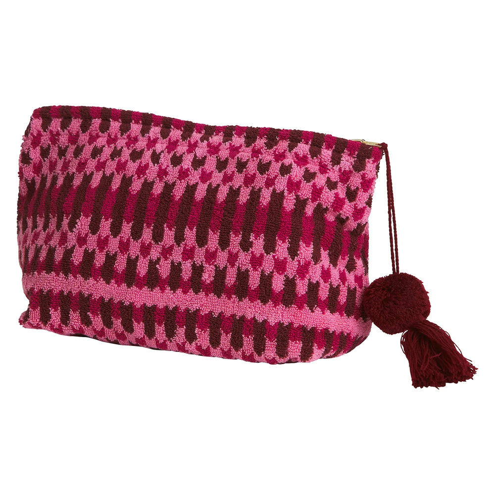 Different size Arlette Terry Pouch - Cosmo Pink placed in vanity cabinet