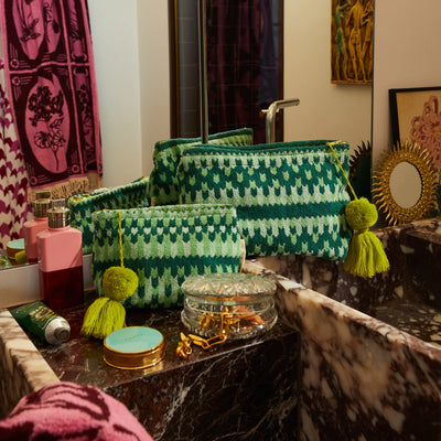 Different size of Arlette Terry Pouch - Jade placed in vanity cabinet