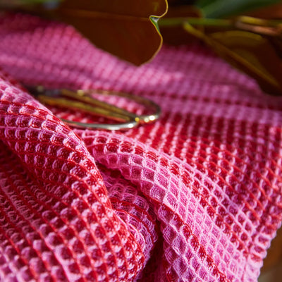 closer look of Brigitte Tea Towel - Cosmo Pink and scissor