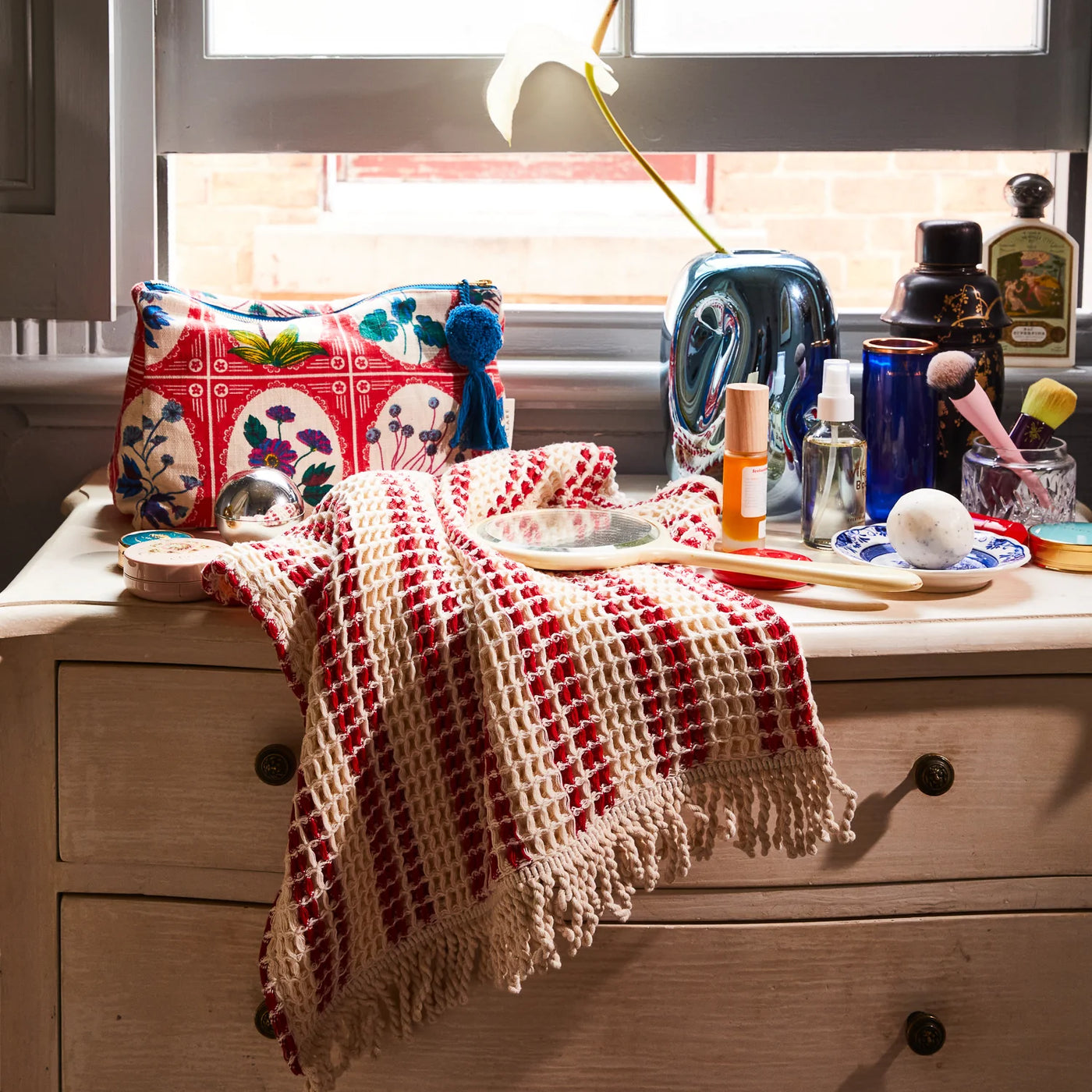 table with mirror, towel and Gigi Cosmetic Bag