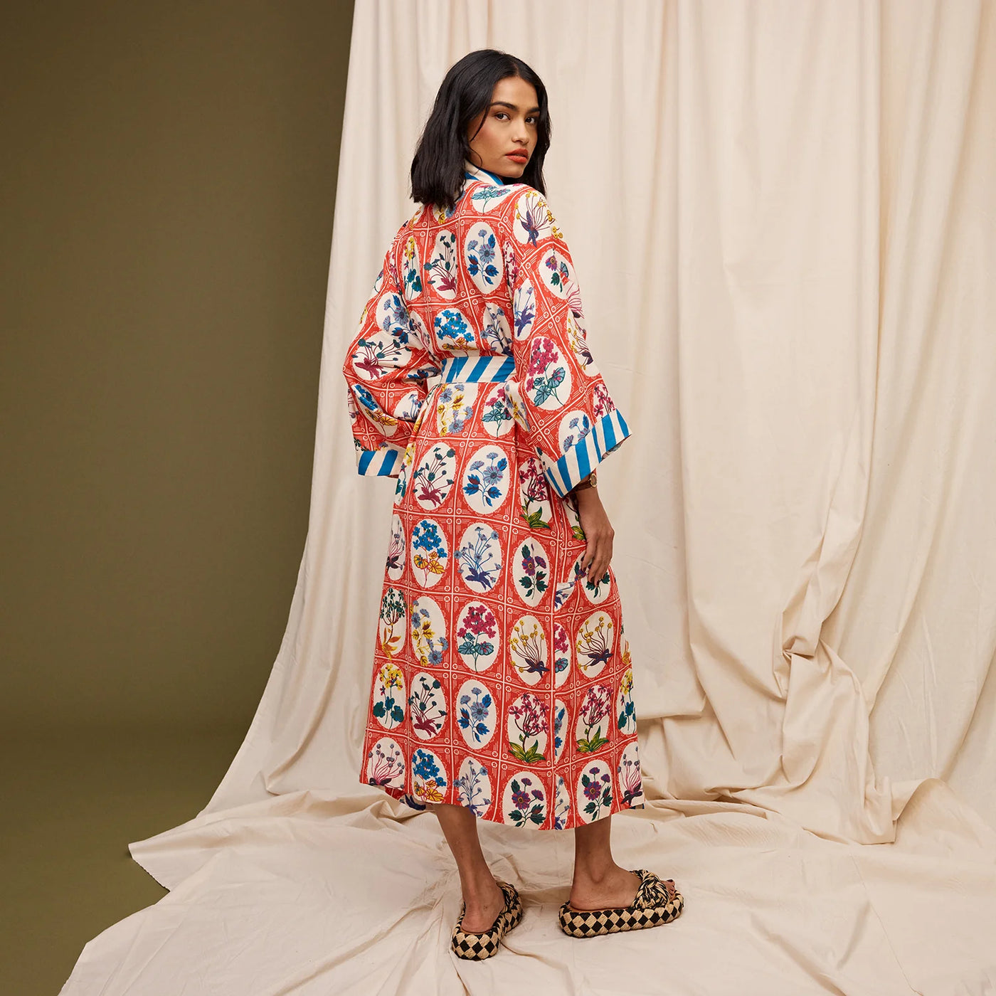 woman facing the back wearing Gigi Cotton Bath Robe