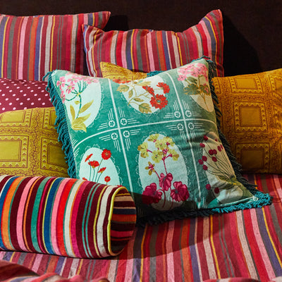 bed with stripe pillow and Gigi Velvet Cushion - Forest
