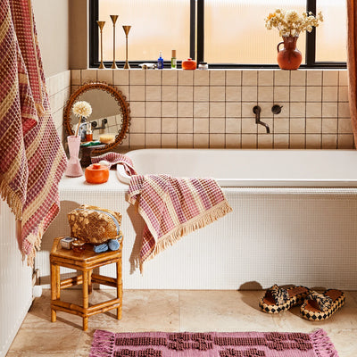 bath tub with sage and clare kanti waffle towel in ponsy
