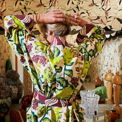 Woman wearing Margot Cotton Bath Robe facing the bak inside the bathroom
