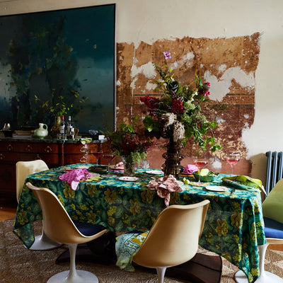 table with Margot Table Cloth in Forest with flower arrangement and plates