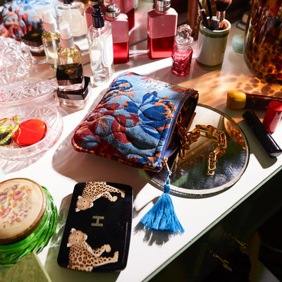 vanity table with fragrance and make up and Margot Velvet Pouch