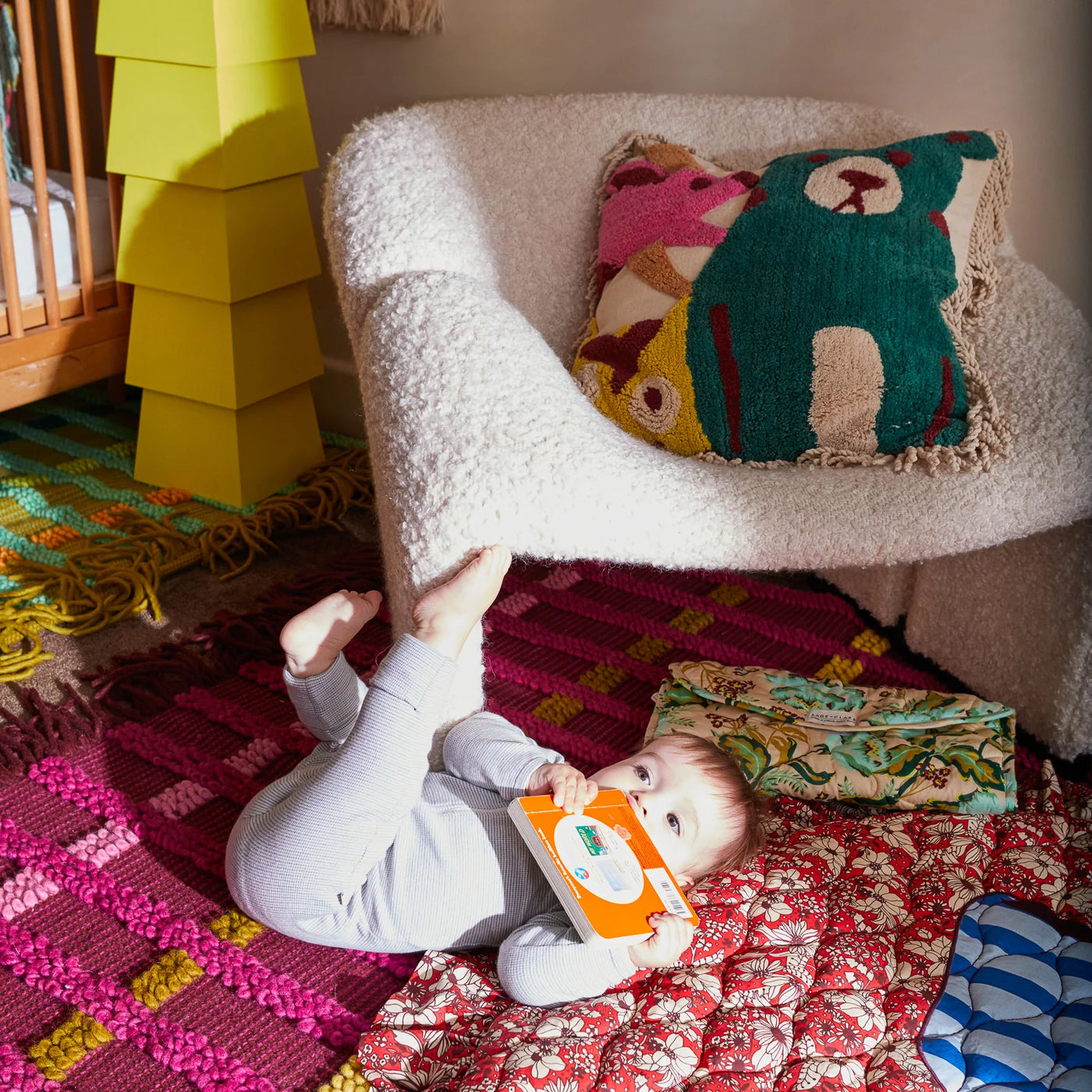 baby beside chair with Monty Tufted Cushion