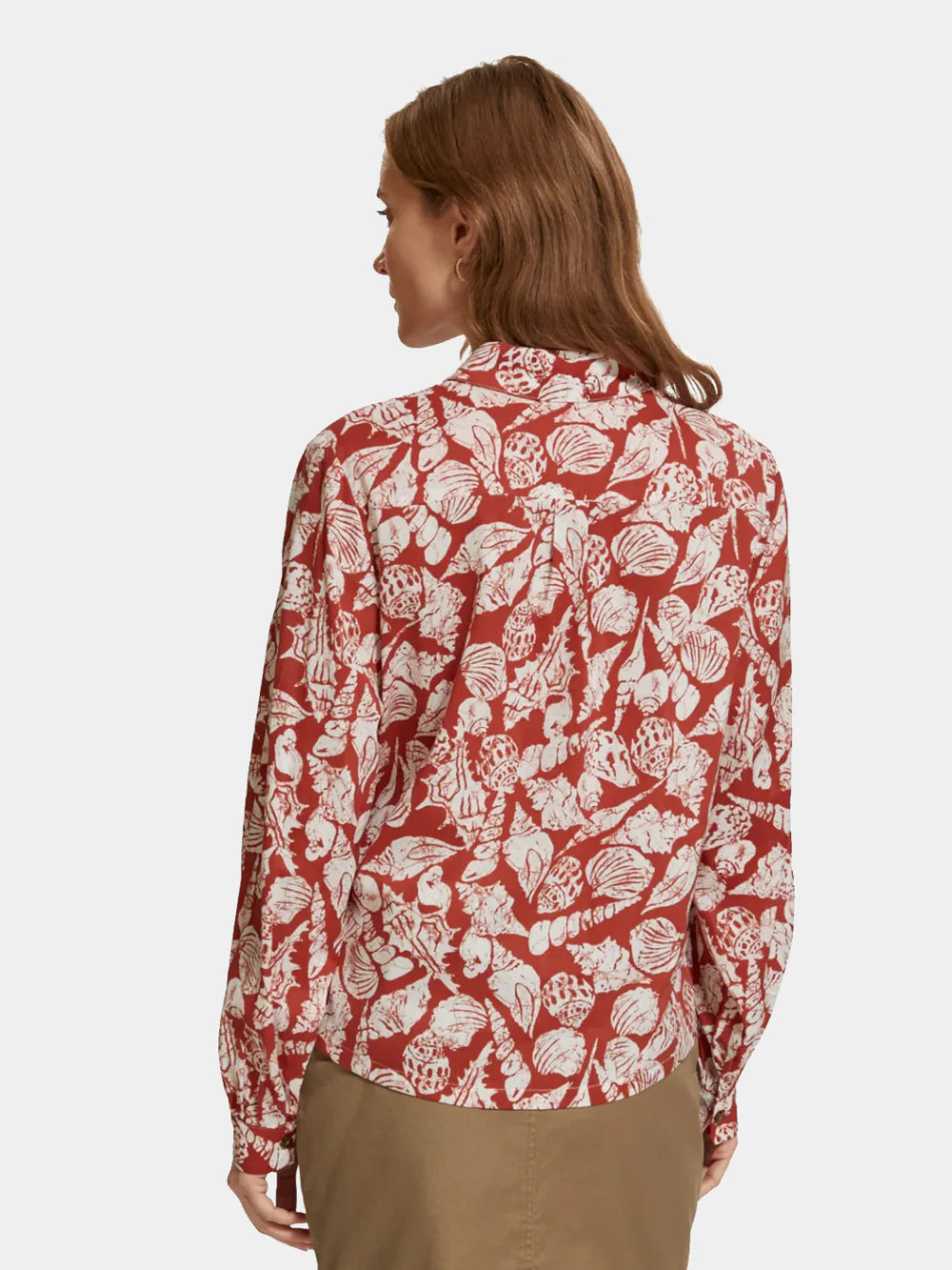 man wearing Printed Balloon Sleeve Shirt - Shell Batik and brown mini skirt back view