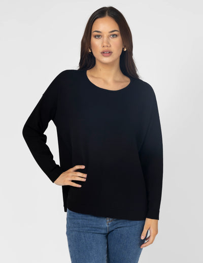 woman wearing Halle Knit Top - Black and denim pants