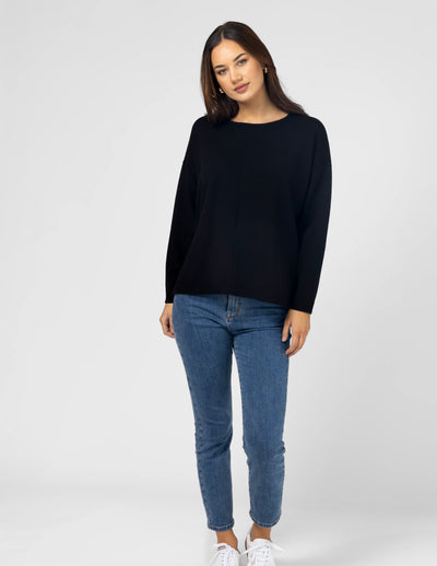 woman wearing Halle Knit Top - Black and denim pants